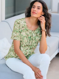 Blouse fluide à manches courtes et motifs floraux