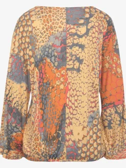 Blouse viscose douce à manches larges et col en V dégagé