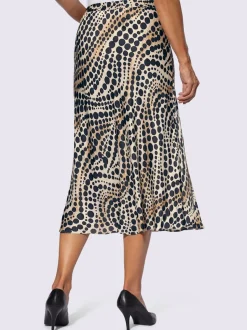 Jupe en satin à pois et ondulations et coupe évasée