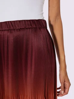 Jupe plissée satin mat élégant