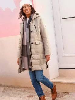 Manteau matelassé glissière latérale pour une plus grande liberté de mouvement