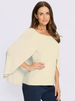 Pull en tricot fin poncho avec bas cousu