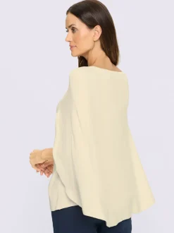 Pull en tricot fin poncho avec bas cousu