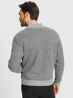 Veste en tricot avec empiècements matelassés
