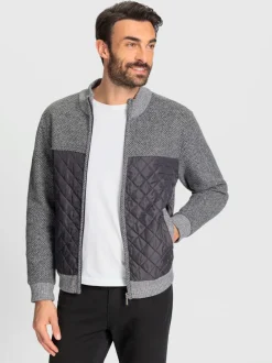 Veste en tricot avec empiècements matelassés