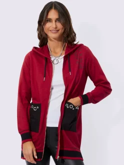 Veste sweat à capuche zippée et poches plaquées décorées avec oeillets